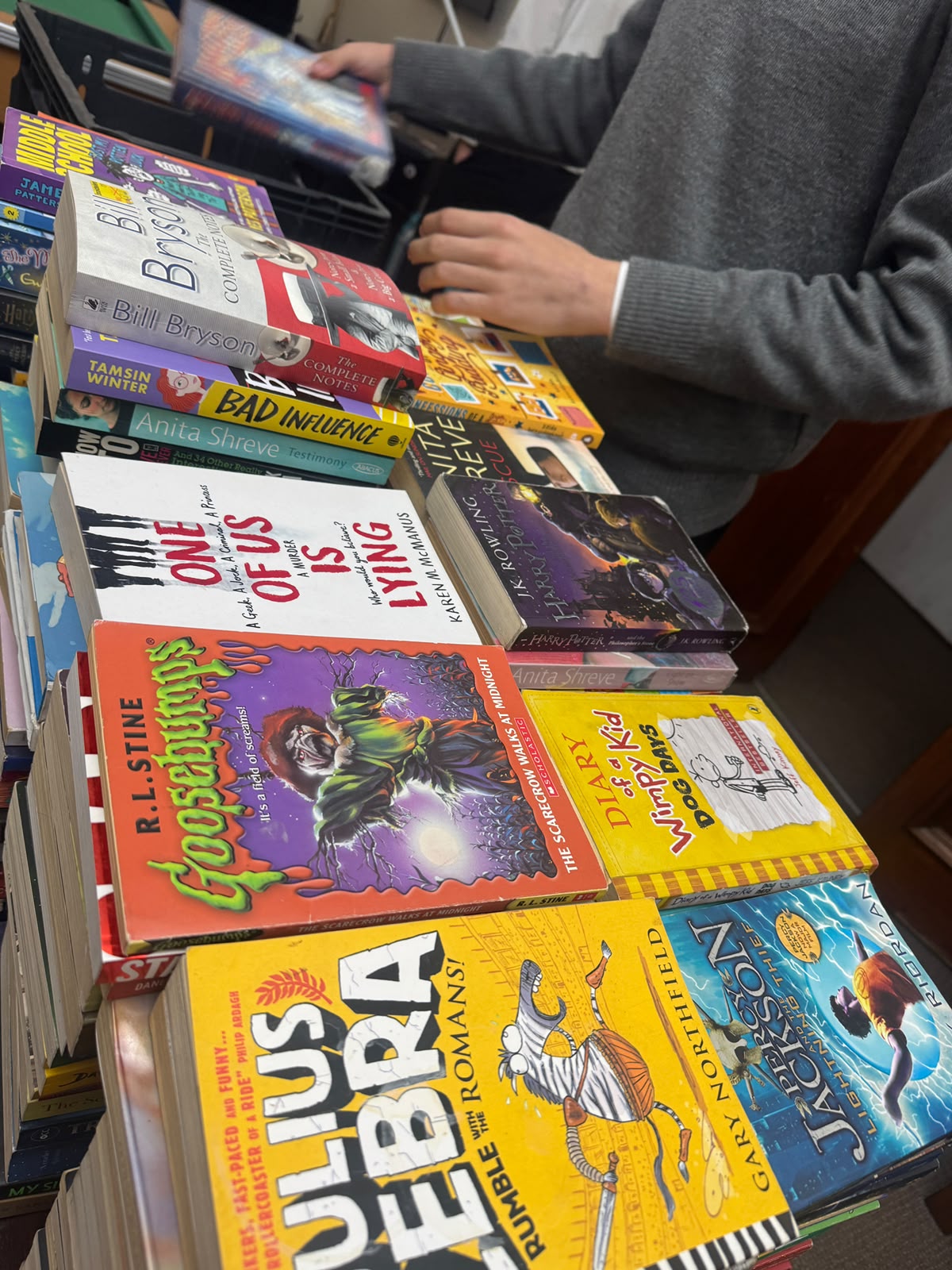 Learners and volunteers organising reading materials